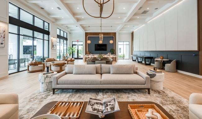 spacious lounge area with modern custom shaped walls and ceiling