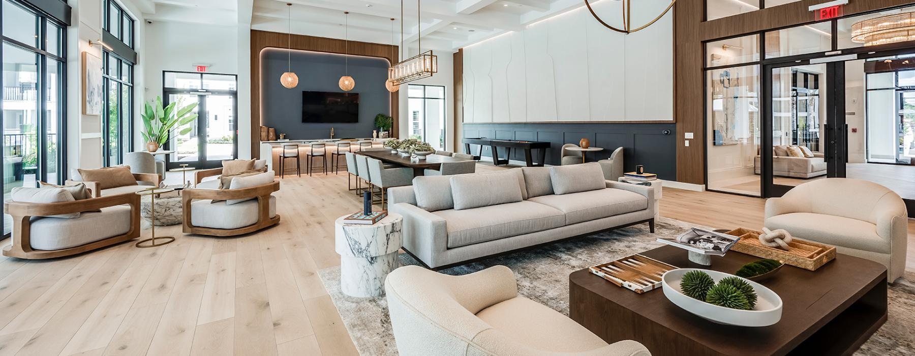 lounge area with wide couches and bright lighting