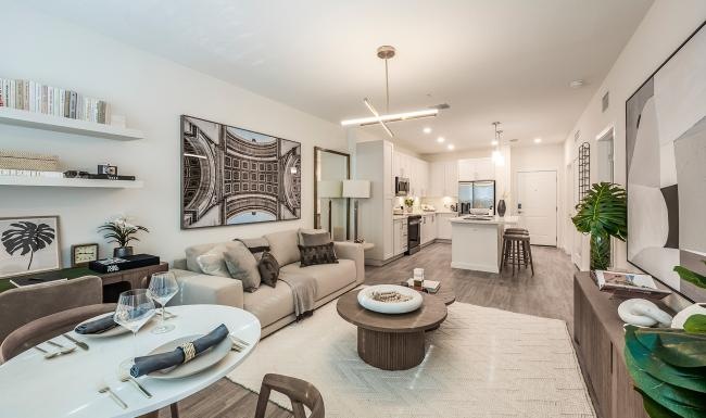 living and kitchen area with bright lighting and ample space for furniture or decor