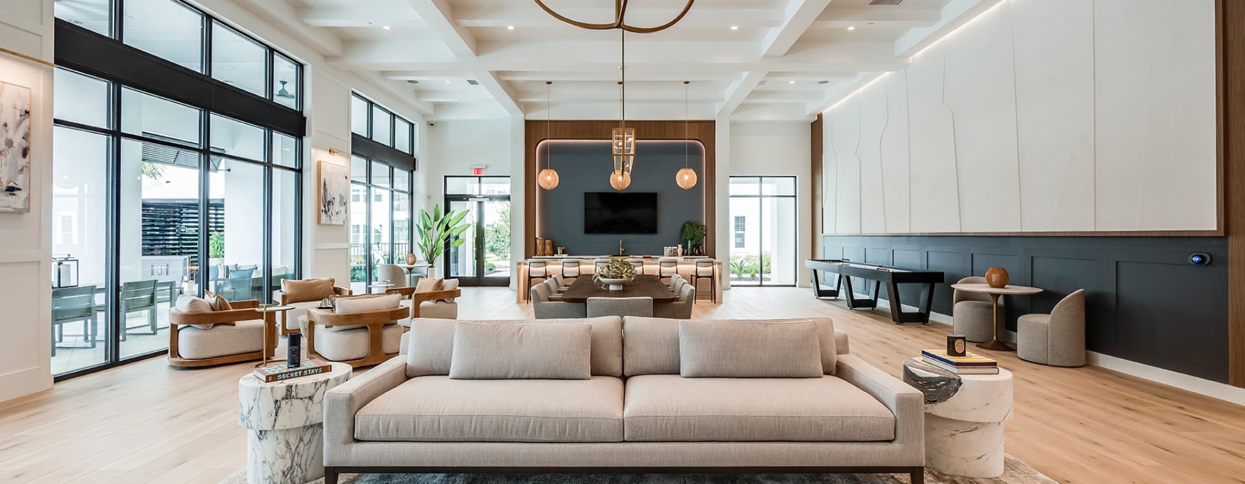 spacious lounge area with modern custom shaped walls and ceiling