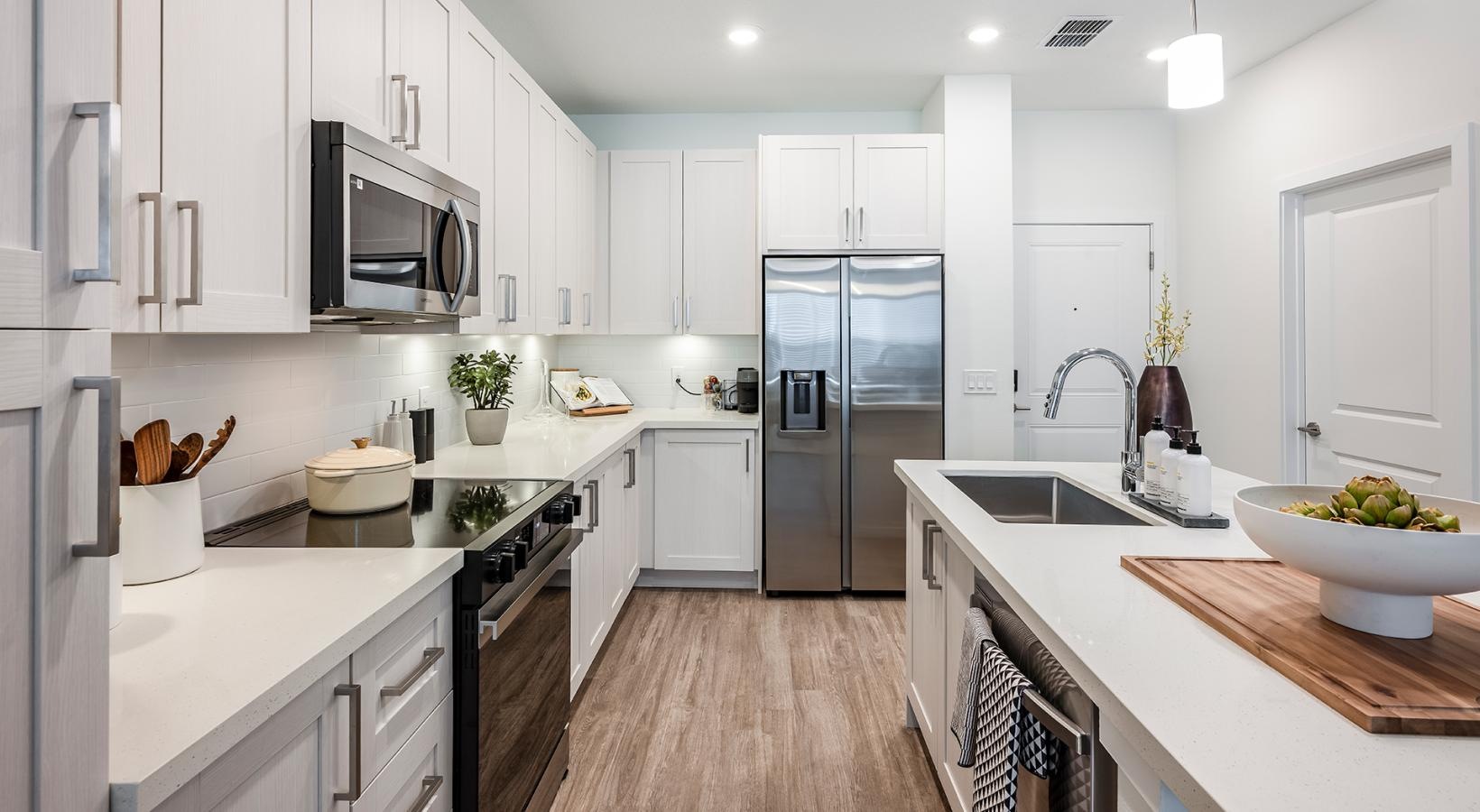 a kitchen with white cabinets